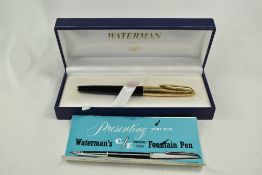 A boxed Waterman Converter Fill fountain pen in black with with rolled gold cap having 14ct nib.