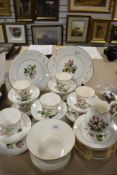 A Victorian porcelain part tea service having floral print pattern with enamel detailing