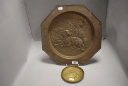 An early 20th century copper wall plaque depicting two Spaniel dogs and game hunt, along with a