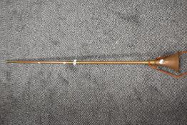 A large copper and brass post or carriage horn