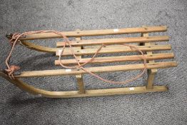 An early 20th century beech wood sleigh