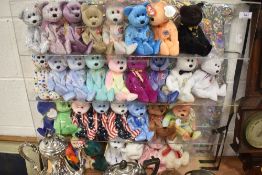 A Perspex display case full of T.Y Beanie babies most still having tags