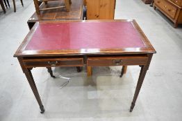 A fine late 19th/early 20th Century side table or desk having leather top, inlaid decoration and