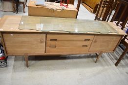 A vintage (mid Century) teak stripped sideboard, width approx. 210cm