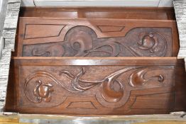 A selection of mahogany panels having pokerwork and foliate decoration