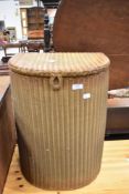 A Lloyd Loom linen basket, bearing Musgroves of Kendal label