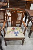 An early 19th Century vase back armchair having woolwork seat