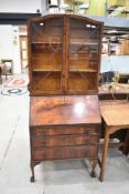 An early to mid 20th Century walnut bureau bookcase