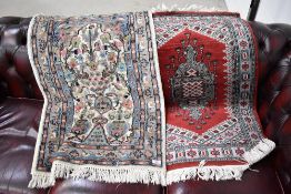 Two Persian style small fireside or prayer rugs