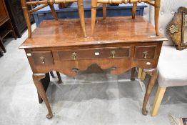 An early 20th Century walnut lowboy in the traditional Queen Anne style