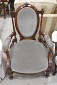 A 19th Century mahogany framed armchair in the Aesthetic style with later dralon upolstery