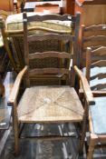 A traditional rush seated ladder back chair