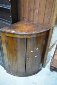 A 19th Century mahogany bow front corner cupboard