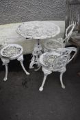 A cast aluminium garden set, table and three chairs