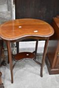 An Edwardian mahogany kidney shaped occasional table