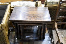 A traditional oak nest of three tables