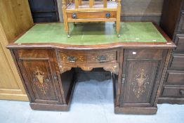 A late 19th Century Sheraton style desk or dressing table, width approx. 137cm