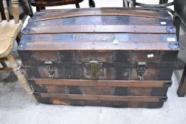 A traditional dome top travel trunk