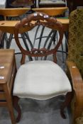 A Victorian balloon back chair