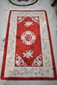 Two modern chinese style rugs, one approx. 153 x 92cm and one circular approx. 1m diameter including