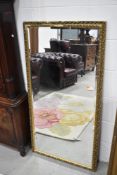 A gilt frame wall mirror , approx. 128 x 67cm