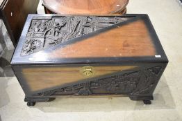 An Oriental camphor wood bedding box, width approx. 102cm