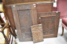 Three antique carved panels, various sizes