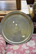 A large brass Eastern tray having Egyptian style decoration