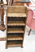 An early 20th Century oak narrow bookshelf