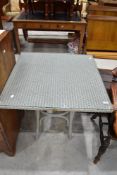 A modern Lloyd Loom of Spalding square table having glass top, approx width 76cm