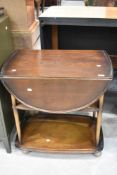 An Ercol tea trolley, dark stain finish