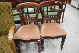 A pair of Victorian mahogany dining chairs having bobbin back