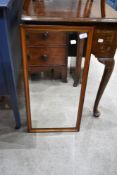 A vintage wall mirror, labelled 'Sadlers' , approx. 69 x 35cm