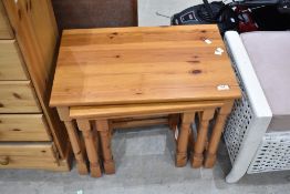 A modern pine nest of three tables