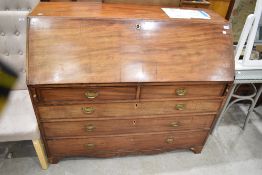 A 19th Century mahogany bureau of wide proportions having fitted interior