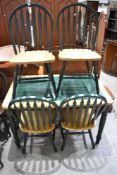 A traditional tile top kitchen table and set of four matching chairs
