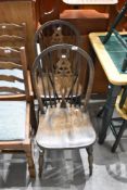 A pair of wheelback kitchen chairs