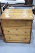 An Oriental style three drawer chest , on castors, with geometric pattern to top