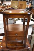 A modern hardwood bedside table with slide and two drawers