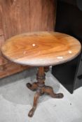 A 19th Century mahogany oval occasional table having turned column and triple splay legs