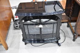 A Dimplex electric heater modelled as a wood burning stove, gloss finish, model SKG208BL