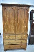 A 19th Century mahogany linen press having two over two drawer base