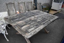 A teak garden set of table and four chairs