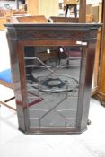 A 19th Century mahogany wall corner display cabinet having astral glazed doors and line inlay
