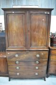 A 19th Century mahogany secretaire, having cupboard over faux drawer concealing fitted interior ,