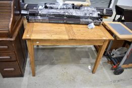 A modern oak extending dining table, closed size of 120 x 90cm