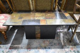 An interesting slate topped coffee table, approx. 121 x 70cm