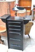 A vintage black ash effect dressing chest