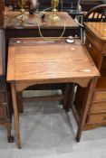 An early 20th Century oak school desk