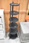A vintage metal pan stand